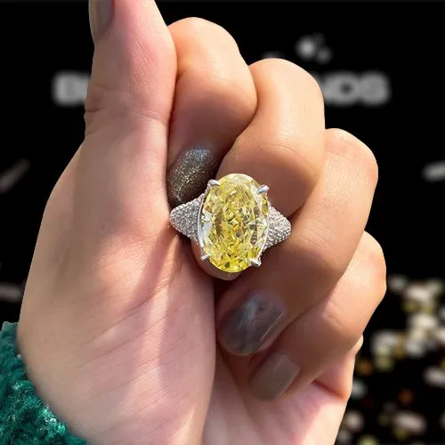 Luxurious Yellow Sapphire Oval Cut Diamond Engagement Ring