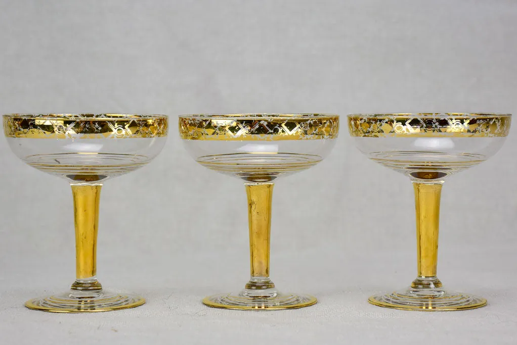 Six French champagne cups with gold decoration