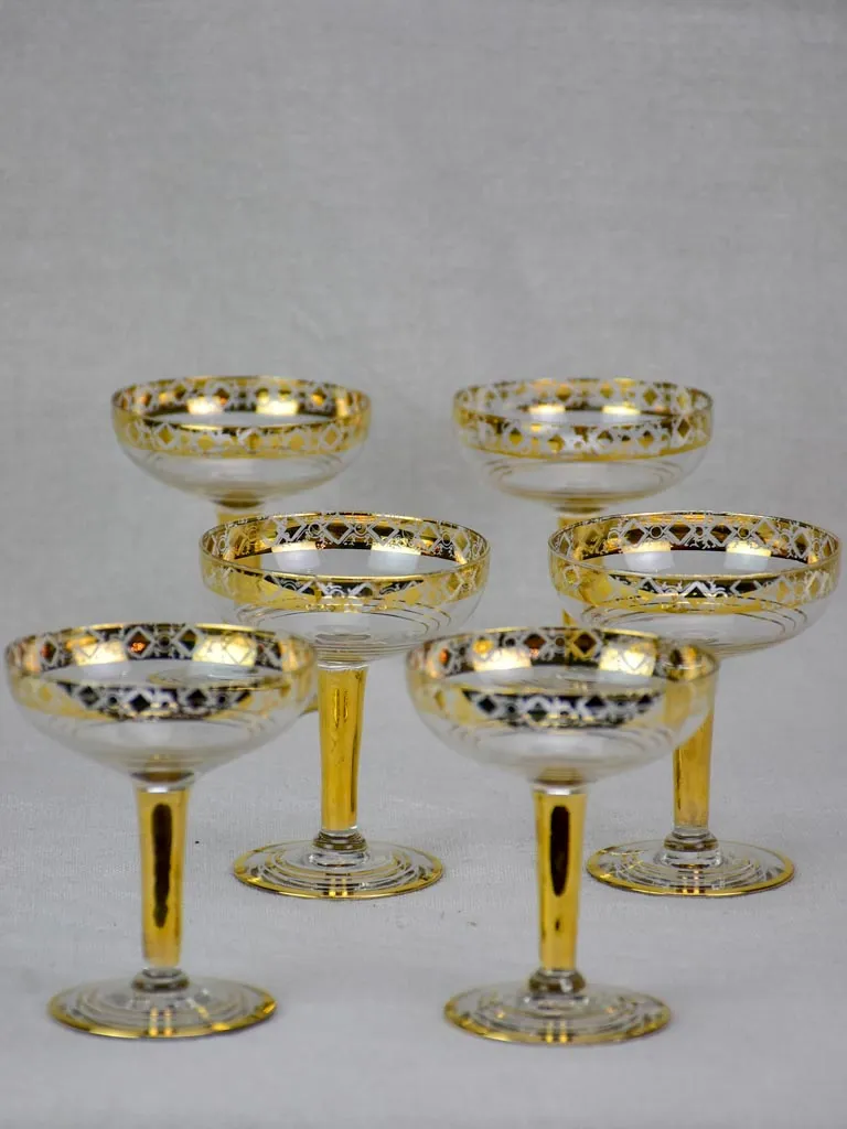 Six French champagne cups with gold decoration