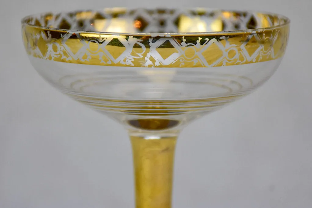 Six French champagne cups with gold decoration