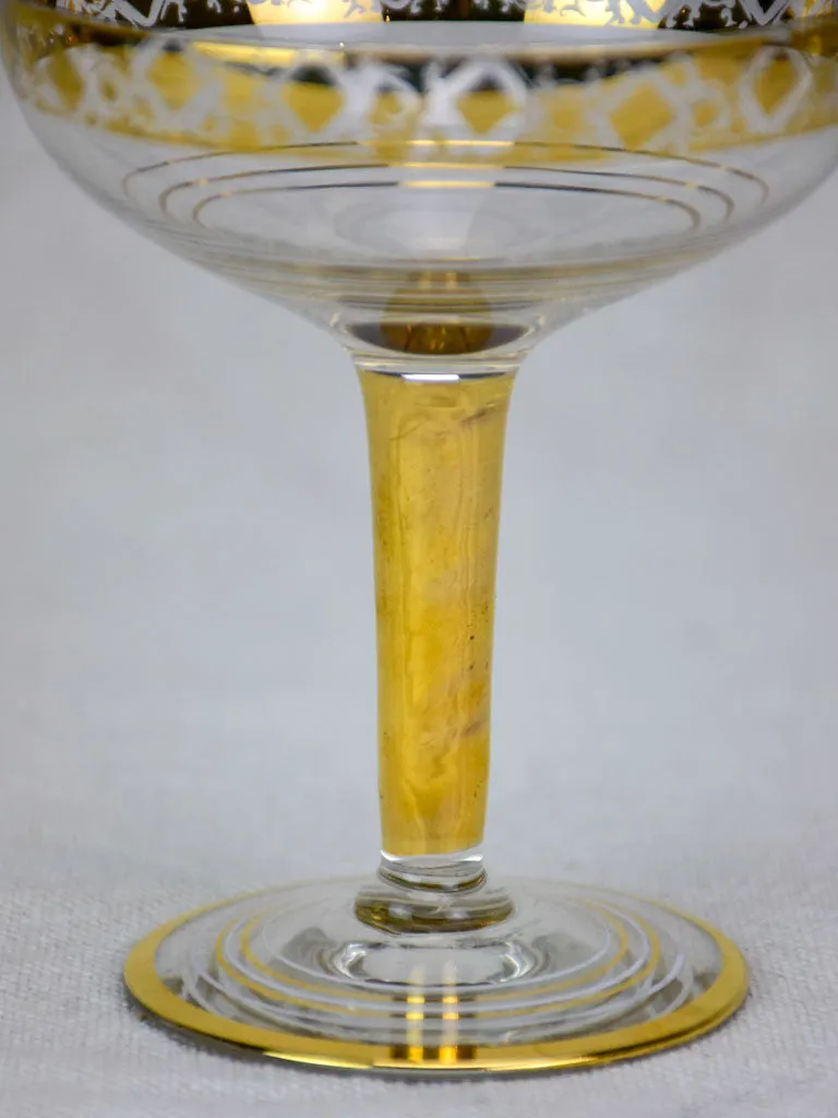 Six French champagne cups with gold decoration